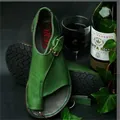 Detail view of green leather toe-loop sandals with buckle strap and rubber sole - 35 / Green