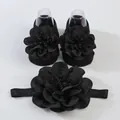 Primer plano de set de calcetines y diadema para bebé con grandes flores de gasa - 0-1 Año (Talla Única) / Negro (Calcetines Flores + Diadema)