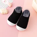 Black knitted toddler walking shoes featuring a soft white rubber sole and breathable mesh - 12.5cm / Toddler Shoes (A08) / Black