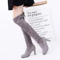 Detail of grey suede-like over-the-knee high heel boots with tie-back design. - 35 / Gray