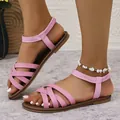 Elegant women's pink flat sandals with elastic ankle straps for beach and summer. - Pink