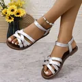 Elegant silver flat sandals for women featuring retro cross straps and ankle buckle - Silver