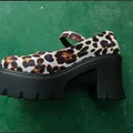 Detailed side view of leopard print platform Mary Janes with stylish chunky high heels. - 35 / White Leopard