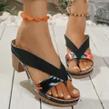 Detailed view of women's thick heel sandals with colorful tropical print and cross straps - Black Floral