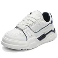 Stylish white men's chunky dad sneakers featuring blue accents and a thick platform sole - 42 / White Blue