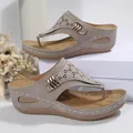 Grey wedge thong sandals for women featuring stylish laser-cut patterns and gold accents. - Gray