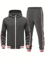 Detailed view of men's grey tracksuit set featuring side striped ribbons and hood - Dark Gray