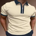 Detailansicht eines beigen Herren-Poloshirts mit marineblauem Kragen und Reißverschluss - S / Oberteile / Gebrochenes Weiß