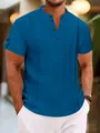 Close-up of blue short sleeve Henley shirt with crinkle texture and button detail - Sapphire Blue