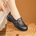 Elegant black soft-sole leather loafers for elderly women featuring a brown knot accent - 35 / Flats / Black