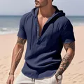 Close-up detail of a men's navy blue linen hooded Henley shirt featuring wooden buttons - S / Tops / Navy Blue
