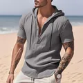 Grey breathable linen hooded Henley shirt for men in a casual outdoor beach setting - S / Tops / Gray