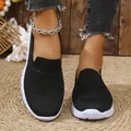 Close-up of women's black breathable mesh slip-on shoes with comfortable white soles - 36 / Black