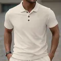 Close-up of cream men's polo shirt featuring heavy jacquard texture and buttons - S / Tops / Khaki