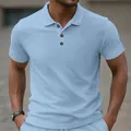Close-up view of light blue jacquard polo shirt featuring textured geometric pattern - S / Tops / Sky Blue