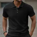 Close-up of black jacquard polo shirt with textured pattern and classic collar - S / Tops / Black
