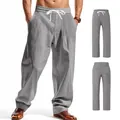 Men's loose grey linen casual pants featuring a drawstring waist and dual pockets - Gray