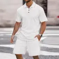 Detail of men's white jacquard texture polo shirt and matching drawstring shorts. - White