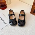 Classic black patent leather girls' Mary Jane shoes with a delicate bow and strap. - Size 23 (Inner Length 14.3cm) / Black