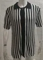 Close-up of vertical black and white striped knitted polo cardigan with buttons - M / Tops / Black