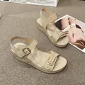 Elegant beige platform wedge sandals featuring stylish gold buckles and decorative studs - 36 / Beige
