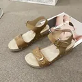 Casual tan flat sandals for women with stylish buckle straps and metallic rivets - 36 / Khaki