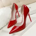 Elegant red patent leather pointed-toe high heel stilettos with side cutout design. - 34 / Pumps (638-5) / Red