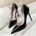 Elegant black patent leather pointed toe pumps with side cut-out and sleek stiletto heels. - 34 / Pumps (638-5) / Black