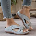 Detail view of light blue wedge sandals with hollow laser-cut patterns and floral accents - 36 / Light Gray