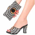 Elegant set featuring black and white rhinestone high heel mules with matching clutch bag - Black