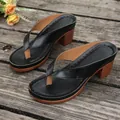 Elegant black thong sandals featuring a stylish wooden-look block heel for summer wear. - 36 / Black
