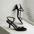 Elegant black stiletto high heel sandals featuring minimalist ankle strap and open toe design - 35 / Black