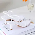 Elegant white kitten heel sandals with thin straps on a lifestyle background - 35 / White