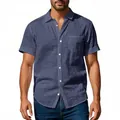 Detailed view of a men's navy blue short sleeve linen shirt with a relaxed fit on a model - S / Tops / Navy Blue