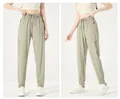 Voor- en zijaanzicht van de uniseks sneldrogende joggingbroek van ijszijde met trekkoord - M / Bottoms / Gecuffte Pijp / Khaki