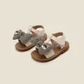 Detailed view of cream baby girls sandals featuring a plaid bowknot and cute cartoon accent - Inner Length 11.0cm / Beige (38MBX7031)