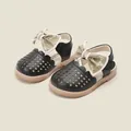 Classic toddler girl black closed-toe sandals featuring a large beige decorative bow - Inner Length 11.0cm / Black