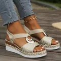 Detailed view of women's wedge sandals with metallic ring buckle and rope platform - Off White