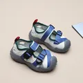 Macro detail of the breathable mesh and adjustable buckle straps on boys sport sandals - 26 / Beige Blue