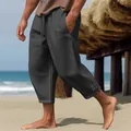 Detalle de los pantalones de lino gris para hombre con cordón y abertura lateral en la playa. - Negro