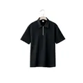 Detailed view of black textured jacquard fabric and zipper collar on men's polo shirt - Black