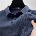 Close-up of blue textured non-iron men's polo shirt fabric with high elasticity - S / Tops / Navy Blue
