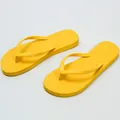 Vibrant yellow beach flip-flops with comfortable flat soles and minimalist design - 35-36 / Yellow