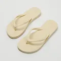 Minimalist cream thong flip-flops with flat sole for beach and outdoor summer wear. - 35-36 / Off White
