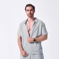 Detail shot of men's casual light blue short sleeve zip-up shirt with jacquard texture - S / Tops / Gray