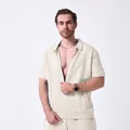 Detail view of men's beige jacquard zip cardigan and shorts set with textured fabric - S / Tops / Khaki