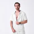 Detail view of men's white jacquard short-sleeve zip-up casual jacket texture - White