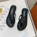 Black lightweight thong flip-flops with knotted strap design for summer - 35 / Black
