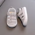 Comfortable soft-sole toddler sandals in light grey featuring a breathable hollow design - Gray
