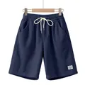 Close-up macro view showing navy blue corduroy fabric texture and white drawstring details - Navy Blue